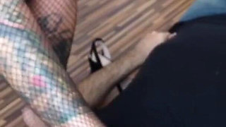 Blonde tattooed lady and her foot slave