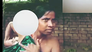 Desi girl is taking a bath outside