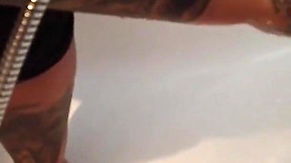Tattooed blonde MILF washes her feet
