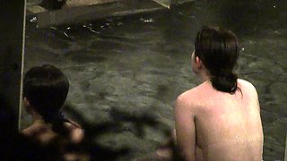 Kinky voyeur watches beautiful Oriental girls taking a bath