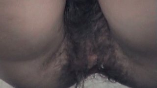 Cute brunette white chick with extremely hairy pussy spied in the toilet