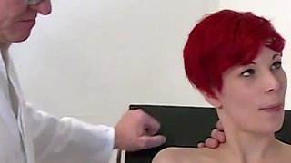 Sexy redhead gets fucked in threesome in the doctors office