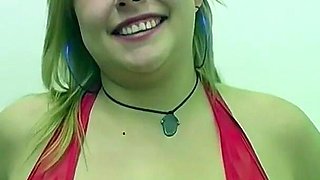 A Barrage of Facial Cumshots While She Sits Encircled by Many Cocks