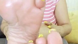 MILF in fishnet enjoys foot fetish