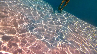 Ehibitionist nudist girl in public swimming