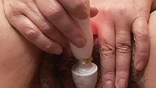 Masturbating with Vibrator on Mature Clitoris