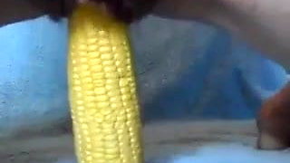 Girl Putting A Corn In To The Pussy