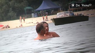 Hot nudist woman captured by a hidden beach camera