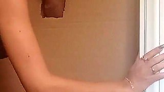 In a Nylon Catsuit and High Heels I Suck a Cock and Fuck It in a Gloryhole Until It Cums in My Mouth