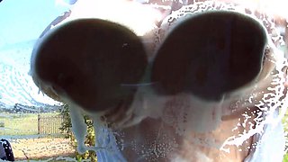 Blonde is flashing her big boobs in the outdoors