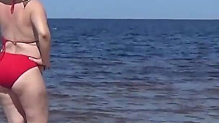 Funny Mommy Has Fun on the Beach with Young Guys