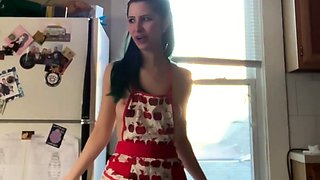 Sexy slender housewife flaunts her perky tits in the kitchen