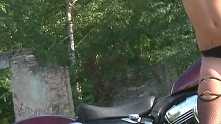 Fabulous brunette enjoys posing outdoors