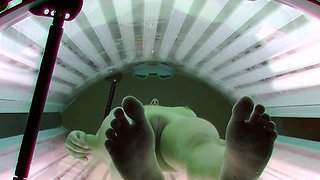 Cute brunette in solarium