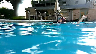 Couple Underwater Diving and Swimming