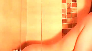 Hot babe with perfect big boobs taking shower