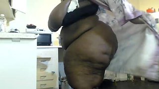 African Stepmum Stripteasing and Masturbating at Then Kitchen
