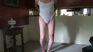 Crossdressing slut in a leotard shakes his womanly ass.