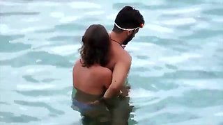 Naked girl caught jerking her boyfriends cock on the beach