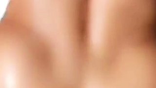 Brunette seductress working her big boobs and hot ass