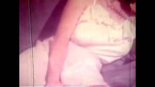 Vintage Redhead with Huge Boobs and Black Stockings Has Solo Sex in Her Bed