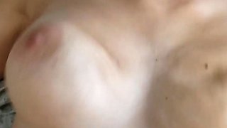 Busty curly brunette with big boobs fucks on couch