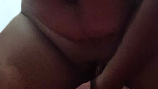 A young beauty with a big ass masturbates her pussy with a jar of cream