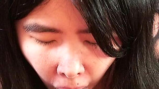 Chinese Girl Fits Her Tiny Mouth Around a Thick Black Cock