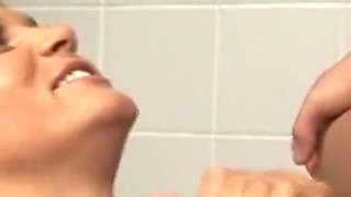 Willing in the bathroom with two cocks to do