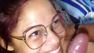 cheating wife in glasses gives a perfect deepthroat blowjob and receives a facial cumshot in her face and glasses