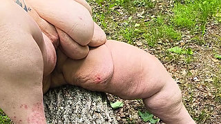 Sucking on a Straw in the Woods Squirting on Tree on Her Knees
