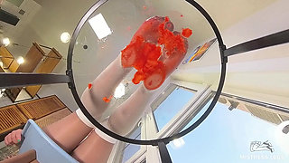 My Nylon Feet Squeezing Strawberry Juice on a Glass Table