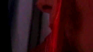 Redhead nurse sucks cock at a gloryhole