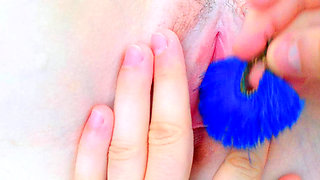 brushing the lips of her petite pussy