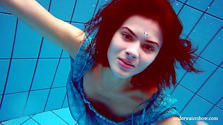 Pretty hot Russian chick Marusia gets naked under the water