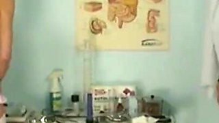 The blonde nurse masturbates with a big black phallus in front of the patient on crutches