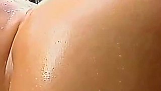 Kara Novak and Cheyenne Cooper have fun with a dildo outside