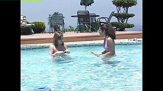 Adorable teens have lesbian sex in an outdoor pool