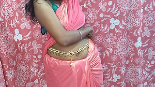 Desi Hot Bhabhiji Wearing Pink Saree in the Bedroom