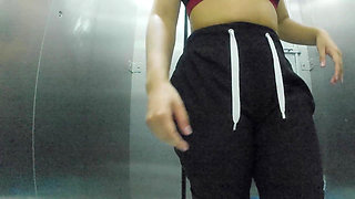 She Records Herself Changing Clothes in the Bathroom of the Shopping Center