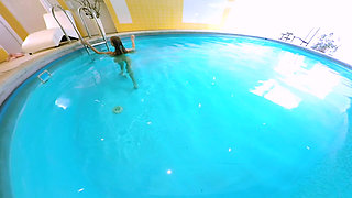 Blonde Enjoys Solo Play in a Pool