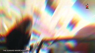 Ass young Arab woman with curly hair and olive jeans