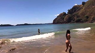 Horny babes masturbating on the beach
