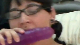 Willing brunette masturbates on her bed with sexy toys