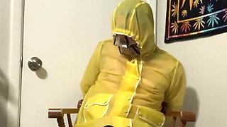 Yellow PVC raincoat bondage Part 2