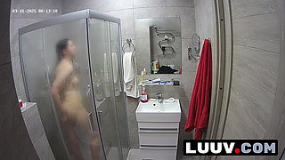LUUV. A brunette showers, used to amateur cameras, showing her natural body
