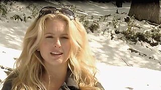 Hot blondies in sexy lingeries showing their big boobs on a snowy mountain