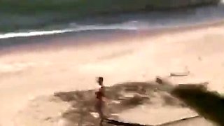 A Voyeur Films A Couple On Beach