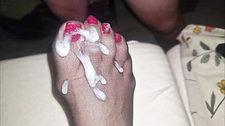 Big semen load on wife's nylon feet with red polish long toenails