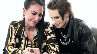 Inked Mature With Big Tits Gives Blowjob To Emo Stud